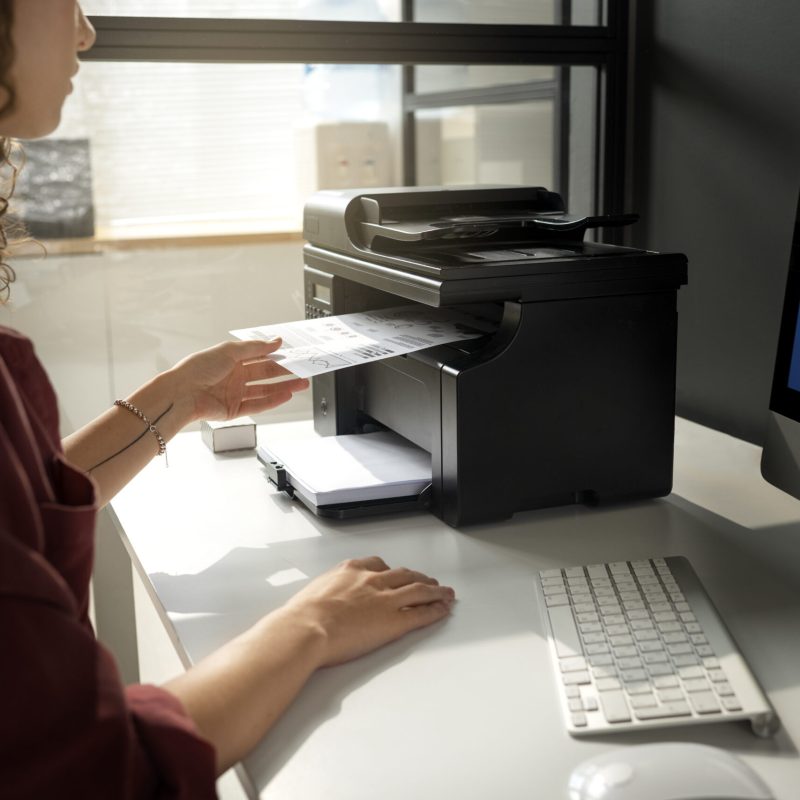 side-view-woman-working-with-printer